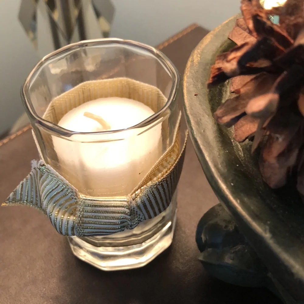 Floral, candle arrangement. Dark green, gold, silver. Votive vanilla candle